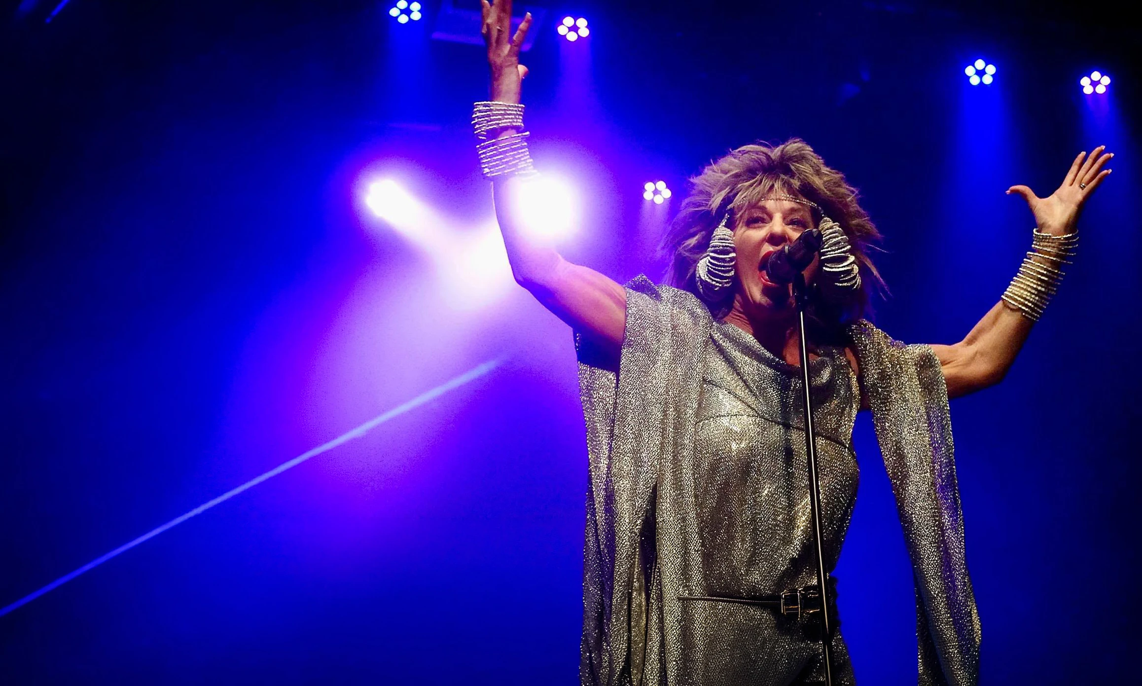 Julie Nevada performing as Tina Turner on stage